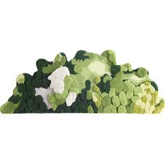 a pile of green and white rugs sitting on top of each other in front of a white background