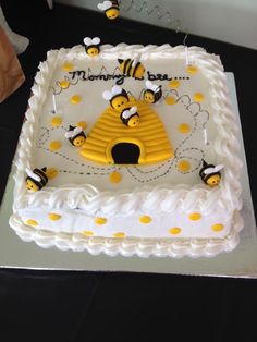 a birthday cake decorated with bees and honeycombs