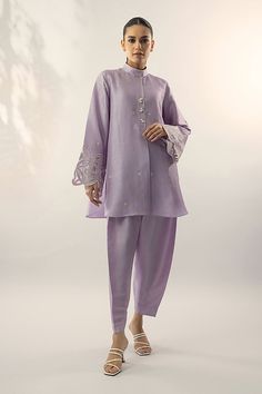 A refreshing lilac shade on a raw silk kurta, is adorned with embroidery on the sleeves and pearl buttons. Pair it with a co-ord trouser. Classy, elegant and summer ready. Indian Co Ord Set Casual, Sania Maskatiya Casual, Silk Wedding Sets With Set-in Sleeves, Elegant Lavender Festive Sets, Elegant Lavender Sets For Festive Occasions, Elegant Festive Lavender Sets, Traditional Spring Kurta With Set-in Sleeves, Elegant Straight Kurta Set With Floral Embroidery, Elegant Straight Kurta With Set-in Sleeves