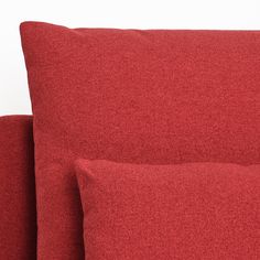 two red pillows sitting next to each other