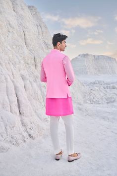 This set features a matka silk bundi, an ombre dyed kurta along with straight cotton pants.From Seema Gujral's Elements collection. DELIVERY TIMEPlease allow 6-8 weeks for your outfit to arrive. FABRIC DETAILSBundi - Matka Silk Kurta - Silk Trouser - Stretchable TR Professional cleaning only. Pink Fitted Nehru Jacket, Fitted Cotton Silk Nehru Jacket For Spring, Fitted Nehru Jacket In Cotton Silk For Spring, Spring Wedding Pink Nehru Jacket, Pink Nehru Jacket For Festive Occasions, Spring Pink Cotton Silk Kurta, Spring Cotton Silk Pink Kurta, Festive Pink Nehru Jacket Straight Kurta, Spring Pink Cotton Silk Sets