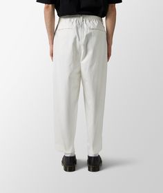 SOFTHYPHEN is known for blending minimalism with sustainability, crafting timeless pieces that reflect both comfort and style. Embodying an ethos of eco-conscious elegance, this brand has rooted itself in the hearts of mindful fashion enthusiasts worldwide.Get ready for the cooler months in style with the Organic Cotton Chino Wide Pants from SOFTHYPHEN's Fall/Winter 2023 collection. Tailored for those who appreciate classic design with an eco-friendly approach, these pants offer a perfect blend White Tapered Cotton Pants, White Relaxed Fit Tapered Leg Pants, White Ankle-length Pants With Welt Pockets, White Ankle-length Bottoms With Welt Pockets, White Tapered Leg Bottoms With Loosely Fitted Hips, White Tapered Cotton Bottoms, Casual White Tapered Pants, Casual White Tapered Bottoms, White Tapered Bottoms With Pockets