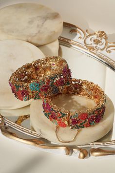 The Fariha Floral Bangle Set is a collection of regal and timeless pieces. These bangles are meticulously designed to enhance your evening regalia with the allure of multicolor stones and the opulence of modern mixed with traditional design. These openable bangles are designed for easy wearing and are one size fits most, with a comfortable size range from 2.6 and above. Crafted with precision, these bangle bracelets are gold-plated on high-quality brass, ensuring both durability and luxury. Key Modern Mixed With Traditional, Ear Chain, Accessories Ear, Bangles Set, Chandbali Earrings, Bangle Bracelet Set, Choker Necklace Set, Jhumka Earrings, Bangle Set