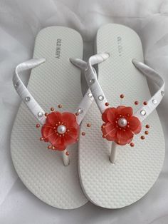 These beautiful flip flops are wrapped with white satin ribbon, the straps are adorned with rhinestones and a single coral flower with pearls in the center.  Ribbon color is white if you are needing other colors of ribbon or decoration please contact me and will be happy to accommodate you! Matching hair pin: https://www.etsy.com/listing/1568682794/bridal-coral-hair-pins-flower-hair All flip flops are handmade to order and the production time is 5-7 business days and then please allow additional Elegant Orange Beach Sandals, White Summer Flip Flops As Gift, White Flip Flops As Summer Gift, White Flower Shaped Sandals For Beach, White Summer Flip Flops For Party, Adjustable Open Toe Flip Flops For Beach Wedding, White Summer Party Flip Flops, Elegant Flower-shaped Beach Sandals, White Wedding Sandals For Beach Season