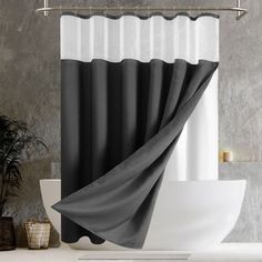 a black and white shower curtain in a bathroom