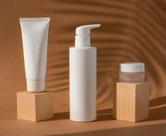 three different types of skin care products on a brown background