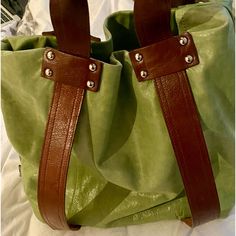 This Bag Is Brand New. I Have Only Worn It One Time. It Is A Very Special Soft Italian Leather “Butter Leather”, The Colour Is Chartreuse And It Is Sleek, Comfortable And A Beautiful Piece. The Tote Is 16 Inches Across And 14 Inches Long, The Two Handles Measure 11 Inches From The Opening Of The Tote To The Top So It Feels Very Comfortable While Carrying, Large Enough To Carry A Laptop And Phone Among Other Things, It's Not A Tote To Fully Stuff, It's More Sleek Slim And Elegant And Looks Very C Green Leather Bucket Shoulder Bag, Green Leather Pouch Shoulder Bag, Green Leather Shoulder Bag With Leather Handles, Everyday Green Leather Shoulder Bag, Green Soft Leather Shoulder Bag, Green Leather Shoulder Bag With Leather Backing, Green Coated Canvas Bag For Everyday Use, Green Coated Canvas Shoulder Bag For Everyday, Green Coated Canvas Shoulder Bag For Errands