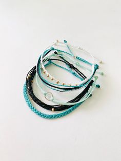 These fun bracelets are waterproof and great for anyone who is often doing outdoor activities. They would make a nice gift. Stack these together, with other bracelets, or wear them by themselves! They are perfect for everyday wear! ∙ ∙ ∙ ∙ ∙ ∙ ∙ ∙ ∙ ∙ ∙ ∙ ◆ PLEASE NOTE ◆ When you first receive these bracelets they may be slightly sticky, which may make it more difficult to adjust. The stickiness does not last. After a day or two of wearing the stickiness will fade and it will be much easier to a Bracelet Bundles, Wax Cord Bracelet, Team Bonding, Preppy Jewelry, Rings Ideas, Bracelet Cordon, Fun Bracelet, Pura Vida Bracelets, Summer Bracelets