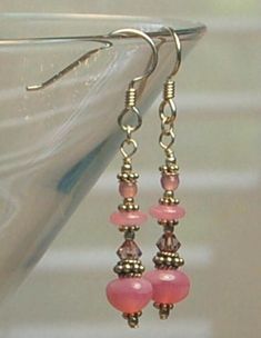 Czech glass, Milk glass, Swarovski crystal and Bali sterling silver beads are featured in these long dangle earrings. All metal is 925 sterling silver. Each earring weighs 1.6 grams compared to a US dime weighing in at 2.268 grams. Size and length can be determined in the photo above as compared to a ruler and a US dime. If you are interested in these earrings and would like more photos or have any questions please feel free to contact me. I usually answer all inquiries the same day within the h Czech Glass Crystal Dangle Earrings, Silver Dangle Earrings With Czech Glass, Elegant Sterling Silver Crystal Earrings With Dangling Beads, Sterling Silver Linear Earrings With Dangling Beads For Gift, Czech Glass Crystal Earrings With Ear Wire, Nickel-free Silver Long Drop Beaded Earrings, Silver Beaded Earrings With Czech Glass, Silver Long Drop Beaded Earrings, Elegant Crystal Earrings With Dangling Czech Glass Beads