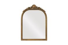 an ornate gold framed mirror against a white background