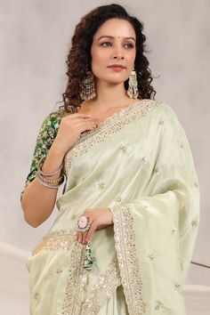 Go for this beautiful pista green embroidered silk sari at parties and festive occasions. The saree comes with designer embroidered saree blouse. Shop designer saree online in USA from Pure Elegance. Disclaimer: The actual product may vary slightly from the image. These are custom orders, hence expect slight variation in color, placement of the motif or buta. ESTIMATED DELIVERYBecause this is a custom order, it would take about 4 weeks from the date of purchase. RETURN POLICYThis product is a custom order and cannot be returned or exchanged. Green Embroidered Sharara In Dola Silk, Pista Green Raw Silk Pre-draped Saree For Diwali, Embroidered Green Sharara In Dola Silk, Pista Green Pre-draped Saree With Dori Work For Wedding, Pista Green Pre-draped Saree With Zari Work For Diwali, Green Dola Silk Pre-draped Saree With Dupatta, Eid Pista Green Dola Silk Pre-draped Saree, Pista Green Dori Work Sharara In Dola Silk, Green Dola Silk Embroidered Fabric With Zari Work