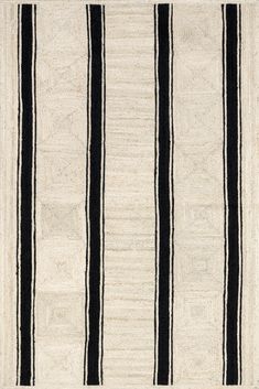 a black and white rug with vertical stripes