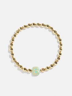 Give your mini the best of both worlds when you scoop up this two-in-one, super stackable bracelet set. The Initial & Heart Kids' Pisa Bracelet Set will feature the initial of your choosing crafted in vibrant enamel and flanked by gold ball beads. We paired each initial with a white enamel heart bracelet, ensuring your little's bracelet stack will be extra meaningful. READY TO GIFT: This item comes pre-packaged in a beautiful box. Please note: intended for children 3+ Heart Kids, Stackable Bracelets, Heart For Kids, Beaded Stretch Bracelet, Heart Bracelet, White Enamel, Bracelet Stack, Bracelet Sizes, Gold Beads