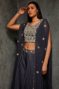 Teal blue crop top with floral embroidered all over and cape attacted. Paired with flared pant.
Components: 2
Fabric: Pure Georgette, Satin Lining, Crepe, Organza
Neckline: Round
Sleeve Length: Cape
Color: Blue
Embroidered
Floral embroidered cape - Aza Fashions Bollywood Style Designer Cape Sets, Bollywood Style Festive Sets With Cape, Festive Bollywood Sets With Cape, Festive Bollywood Cape Sets, Bollywood Style Cape Sets With Dupatta, Bollywood Cape Sets With Dupatta, Festive Eid Cape Sets, Festive Cape Sets For Eid, Festive Sets With Intricate Embroidery And Cape Sleeves