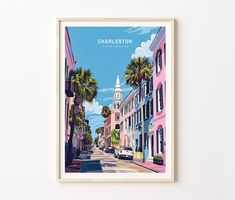 a framed print of charleston, florida with palm trees in the foreground and pink buildings on either side