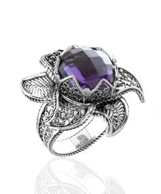 Looking for a stunning and versatile piece of jewelry that's perfect for any occasion? Look no further than The Filigranist 925 Sterling Silver Lotus Flower Women Ring. Made with high-quality materials and crafted with exceptional attention to detail, this cocktail ring features a dazzling 12mm faceted checkerboard round-cut amethyst gemstone that will make you stand out from the crowd. With its enchanting details and natural beauty, this ring is a must-have accessory that will elevate any outfi Lotus Flower Design, The Ring Face, Flower Women, Statement Ring Silver, Sterling Silver Filigree, Purple Stones, Women Ring, Silver Filigree, Amethyst Gemstone