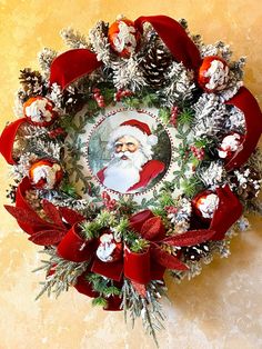 a christmas wreath with santa claus on it