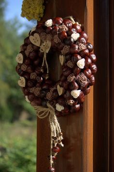 a wreath hanging on the side of a wooden door