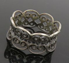 925 Sterling Silver - Vintage Dark Tone Pretzel Knot Band Ring Sz 5 - RG16151  925 Sterling Silver - Vintage Dark Tone Pretzel Knot Band Ring Sz 5 - RG16151  Jewelry Type:         Ring  Metal Type:            925 Silver  Metal Size:             5 Finger  Stone Type:            N/A  Condition:              N/A  Jewelry Weight:     2 Grams  PLEASE NOTE: THIS ITEM IS PRE-OWNED. ALTHOUGH MOST ITEMS ARE IN VERY GOOD CONDITION, SOME MAY NEED CLEANING AND/OR MINOR REPAIRS. WE MAKE A VERY STRONG EFFORT TO UPLOAD CLEAR PICTURES. PLEASE INSPECT ALL PICTURES AND ASK ALL QUESTIONS YOU MAY HAVE PRIOR TO MAKING A PURCHASE. NOT ALL STONES ARE GENUINE, SOME ARE ENHANCED OR CREATED. Victorian Silver Jewelry With Decorative Band, Vintage Round Filigree Ring With Oxidized Finish, Vintage Sterling Silver Jewelry With Decorative Band, Antique Silver Rings With Decorative Band, Antique Silver Ring With Decorative Band, Vintage Silver Ring With Decorative Band, Elegant Oxidized Filigree Ring For Anniversary, Vintage Silver Filigree Ring With Oxidized Finish, Vintage Silver Open Band Jewelry