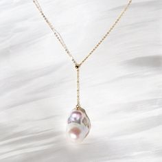 Rainbow After Rain 18K Gold Big Baroque Pearl Charm Necklace Designer Pendant Pearl Size: 16-20mm*22-28mm Pearl Color: Metallic White Pearl Surface: Clean Pearl luster: Excellent Pearl Quality: AAA Pearl Shape: Baroque Flameball Metal: 18k Solid Yellow Gold Ear Wire, not gold-filled or plated Stamp: Au750 Like the most spectacular rainbow that appears after the most terrifying storm, this sparkling big baroque pearl has a peerlessly lustrous pearlescent. Simple yet striking, the necklace features an iridescent natural baroque pearl attached to the femininely delicate gold chain. Wear it, and believe in the rainbow will occur after all the rains and tears in life. Exquisite Teardrop Gold Necklace, Yellow Gold Baroque Pearl Necklace With Pearl Charm, Elegant Yellow Gold Necklace With Baroque Pearl, Elegant Yellow Gold Baroque Pearl Necklace, Yellow Gold Necklaces With Baroque Pearl Pendant, Baroque Pearl Gold Jewelry, Gold Baroque Pearl Necklaces, Gold Baroque Pearl Necklace For Formal Occasions, Gold Baroque Necklace With Pearl Charm