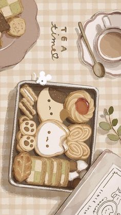 a box filled with cookies next to a cup of coffee and some other items on a table