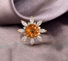 Gemstone: Citrine  Metal: 925 Sterling Silver / 14K Solid Gold / 18K Solid Gold Finish Type: Choose From Above Options Ring Size: Choose From Above Options Gemstone Size: Round 8.00 MM Gemstone Size: MQ 4x2 MM White Zircon Gemstone Size: Round 2.00 MM White Zircon Gem Weight: Approx. 3.80 CTS Metal Weight: Approx. 4 Grams Every Piece of Jewelry we make has a special meaning and story. We use the highest quality USA and Italy made materials like 14K Gold, 925 Sterling Silver, 14K Gold Vermeil, 14 Gold Birthstone Ring With Topaz Gemstone, Gold Topaz Birthstone Ring With Gemstone, Yellow Gold Topaz Crystal Ring With Gemstone, Yellow Gold Topaz Crystal Ring, Yellow Gold Citrine Crystal Ring With Gemstone, Gold Citrine Birthstone Ring With Prong Setting, Gold Topaz Diamond Ring, Fine Jewelry Topaz Gemstone Cluster Ring, Yellow Gold Citrine Crystal Ring In Fine Jewelry Style