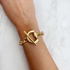 Chunky Gold Snaffle Bit Toggle Bracelet | Gold Horsebit Chain Bracelet | Chunky Gold Chain Stacking Toggle Bracelet | Statement Bracelet This unique toggle bracelet design is perfect as a gift or just to treat yourself. Horsebit - approx. 26mm Rolo chain - approx. 9mm wide Check out more styles in our shop: https://jordanskyjewelry.etsy.com ------------------------------- M A T E R I A L S  Zinc Die Cast, Lead Free 18k gold plated  Handmade and designed in NY. Thanks for supporting our small bus Trendy Chain Bracelet With Toggle Clasp, Adjustable Gold Chain Bracelet With Toggle Clasp, Metal Link Chain Bracelet With Clasp, Trendy Bracelet With Toggle Clasp, Metal Chain Link Bracelet, Metal Link Chain Bracelet, Everyday Metal Chain Bracelet With Toggle Clasp, Trendy Toggle Clasp Bracelet, Gold-tone Chain Bracelet With Toggle Clasp As Gift