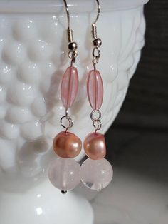 Earrings for the pink lover,cherry quartz drops to rose quartz to show the pale pink color and fresh water pearls with a luster to match. These earrings are hand made to be loved and enjoyed, they will be perfect for a fancy occasion, day at the park, or a day at work. Feminine Pink Pearl Drop Earrings, Pink Teardrop Pearl Drop Jewelry, Feminine Pink Jewelry With Pearl Drop, Feminine Pink Pearl Drop Jewelry, Pink Pearl Drop Earrings In Sterling Silver, Pink Teardrop Pearl Drop Earrings, Pink Pearl Drop Teardrop Earrings, Pink Feminine Dangle Pearl Earrings, Handmade Pink Drop Pearl Earrings