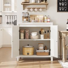 a kitchen with white cabinets and shelves filled with dishes, cups and utensils