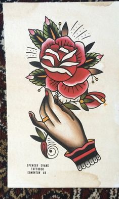 an old school tattoo design with a rose on it's left arm and wrist