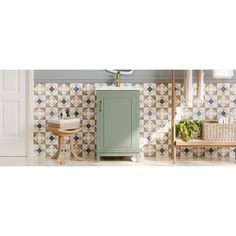 a bathroom with tiled walls and flooring next to a sink