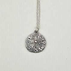 This necklace features an antique silver sand dollar charm. The chain(soldered 2mm x 1.5mm) and findings(10mm lobster clasp and 4mm jump rings) are silver plated. The necklace is available in various lengths. Sand Dollar Necklace, Sea Necklace, Ocean Necklace, Christmas Deals, Sand Dollar, Jump Rings, Necklace Silver, Under The Sea, Silver Necklaces