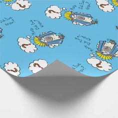 an image of a blue wrapping paper with clouds and sheeps in the sky on it