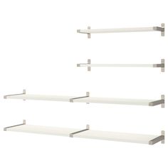 three white shelves with metal brackets on each shelf