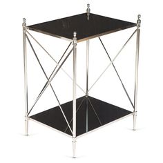 a black and silver side table with two legs on one end, an open shelf to the other