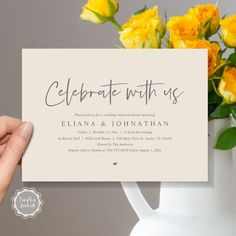 someone holding up a card that says celebrate with us in front of a vase full of yellow roses