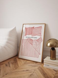 a bed with white pillows and a red drawing on the wall next to a lamp