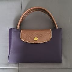 Longchamp Le Pliage Medium Top Handle Bag In Bilberry. One Inside Pocket. Euc A Couple Marks Shown In The Pics Le Pliage Medium, Longchamp Le Pliage Medium, Longchamp Bags, Longchamp Le Pliage, Handle Bag, Womens Tote Bags, Color Purple, Inside Pocket, Top Handle