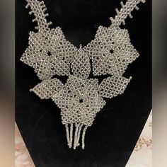 Beautiful Artesanal Necklace! Give Your Wardrobe A Pop Of Glam With This Beautiful Necklace!Nwot #Artesanal #Necklaces #Necklacelover #Jewelry #Accessories #Boutique #Fashion #Collaresdemoda #Joyasartesanales #Hermoso #Ngboutique #Colorglamsparkle Https://Ngboutique.Company.Site Handmade Elegant Silver Flower Necklace, Elegant Handmade Silver Flower Necklace, Handmade Bohemian Necklaces For Evening, Handmade Bohemian Evening Necklaces, Handmade Bohemian Evening Necklace, Handmade Silver Beaded Necklaces For Evening, Silver Handmade Beaded Necklaces For Evening, Elegant Handmade Long Bib Necklace, Elegant Long Handmade Bib Necklace