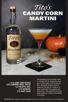 a bottle of candy corn martini next to a glass filled with it's contents