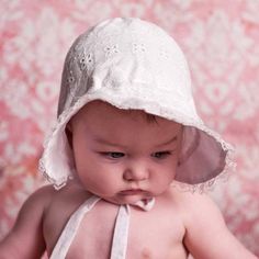 Exquisitely constructed, our classic white bonnet has a flared brim to help shade little faces from the sun. Elastic at back of neck adds a bit of fit. Ties closed to keep bonnet in place. Perfect for the beach, and everyday wear, this lightweight hat is functional and cute. Made in white eyelet embroidered with hearts.• Shell: 100% Cotton, Lining: 65% Cotton, 35% Polyester• Cold handwash, Lay flat to dry• Made in China Baby Bonnet Pattern, White Bonnet, Personalized Baby Hat, Girls Hats, Newborn Girl Hat, Girls Smocked Dresses, Newborn Bonnet, Bonnet Pattern