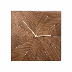 a wooden clock that is on the wall