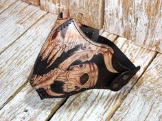 Leather half mask, made with full grain leather which has pyrography done motifs. The inside of the mask is padded. It has an elastic strap which makes the size adjustable. Edges are stitched with black waxed thread. - Full grain leather with pyrography done motifs - Stitched with waxed thread - Has elastic strap, fits sizes M and over (helmet size) This product is shipped via DHL and shipping time is around 5 business days or shorter depending on customs delays. Biker Mask, Motorcycle Face Mask, Motorcycle Mask, Leather Face Mask, Leather Face, Half Mask, Wind Protection, Leather Mask, Half Face