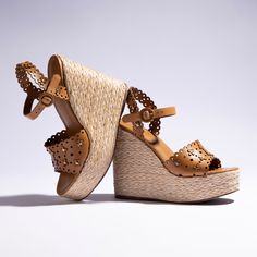 Elevate your everyday this Spring with this playful new platform featuring considered design details that will get you noticed...and comfortable. With a fresh mix of leather atop a raffia base, this new sandal silhouette is ready for its debut. Chic Brown Straw Sandals, Trendy Leather Wedge Sandals With Textured Sole, Luxury Summer Wedge Sandals, Chic Straw Platform Sandals, Summer Leather Platform Wedge Sandals, Leather Platform Wedge Sandals For Summer, Natural Straw Wedge Sandals With Platform, Chic Straw Platform Wedge Sandals, Leather Wedge Sandals With Textured Sole For Summer