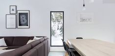 a living room filled with furniture and a sliding glass door