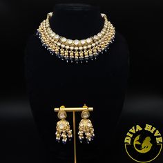 Beautiful Polki kundan hasli style necklace with jhumka Elevate your style with the exquisite Diva necklace and earring set, exclusively available at our luxury Indian jewelry store. Made with the finest materials, this set is a true reflection of Elegance and glamour, designed to take your look to new heights. Each piece in the set is meticulously crafted to ensure superior quality and attention to detail. The necklace and earring set is the perfect addition to your collection offering versatil Festive Dual-tone Kundan Bridal Necklace, Dual-tone Kundan Chandbali Bridal Necklace, Dual-tone Chandbali Kundan Bridal Necklace, Bollywood Style Kundan Bridal Necklace In Dual-tone, Bollywood Style Dual-tone Kundan Bridal Necklace, Dual-tone Kundan Bollywood Necklace, Dual-tone Bollywood Kundan Necklace, Bollywood Style Dual-tone Kundan Necklace, Kundan Chandbali Jewelry Sets For Designer Wear