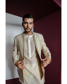 Moondust Jacket Set - Contrast by Parth An embroidered shawl-collar jacket perfectly complements a textured Chanderi kurta and pants ensemble Included in purchase: Jacket, Kurta and Pants Product Specification Color: Cream (can be customized) Fabric: Pure Silk Occasion: Formal Event, Wedding, Bridal, Reception Style: Jacket Set Designer: Contrast by Parth Care: Dry Clean Only Work: Hand Embroidered ( Variation in color, fabric & detail is possible. Model images are only representative.) This can be customized in any color, size or style of your choice. ** Please contact us at 19257910374 for customization options. Delivery time for customized outfits is 4 - 6 weeks. Luxury Classic Cream Kurta, Luxury Raw Silk Nehru Jacket With Chikankari Embroidery, Luxury Off-white Nehru Jacket With Cutdana Detailing, Men Waistcoat Outfits, Striped Kurta, Elegant Portrait, Kurta And Pants, Bride Indian, Wedding Trousseau