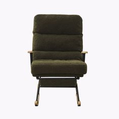 a chair that is sitting on top of a wooden frame and has a green seat cushion