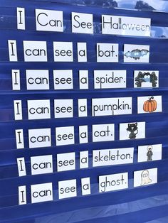 a blue display case with cut out words and pictures on the front for sight word practice