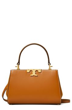 Gleaming logo hardware and rich leather distinguish a scaled-down satchel fitted with multiple straps for styling versatility. Magnetic-snap closure Top carry handle; removable, adjustable crossbody strap Dual interior compartments with center divider; two card slots Structured silhouette with flat base and protective metal feet Lined Leather Imported Tory Burch Bag, Zadig And Voltaire, See By Chloe, Leather Care, Leather Satchel, Valentino Garavani, Cognac, Calf Leather, Whiskey